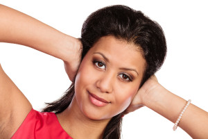 Mixed Race Woman Closing Ears With Hands.