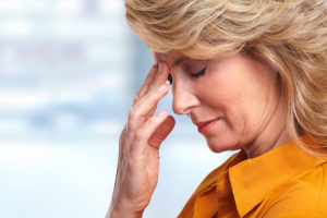 Woman having migraine headache. Stress and depression.