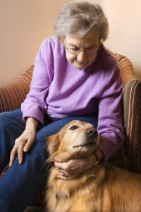 Elderly Caucasian woman in bedroom at retirement community cente