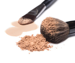 Liquid Foundation And Loose Cosmetic Powder With Makeup Brushes