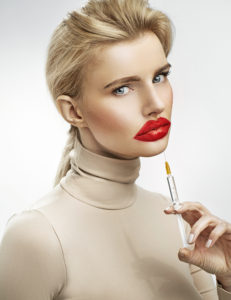 Exaggerated injection to the lips of a beautiful blonde